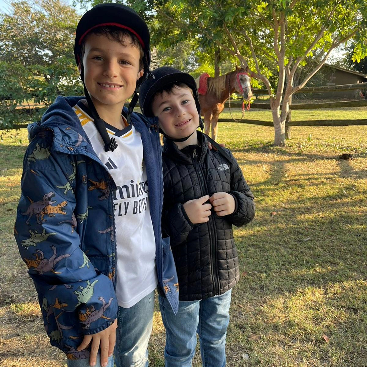 May be an image of 2 people, child, people smiling, pants and hat
