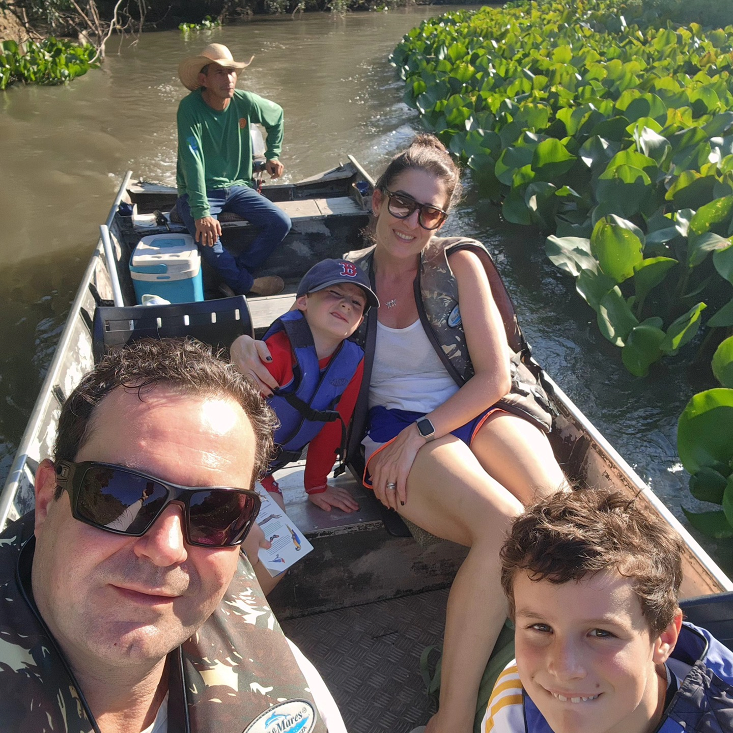 May be an image of 4 people and boat